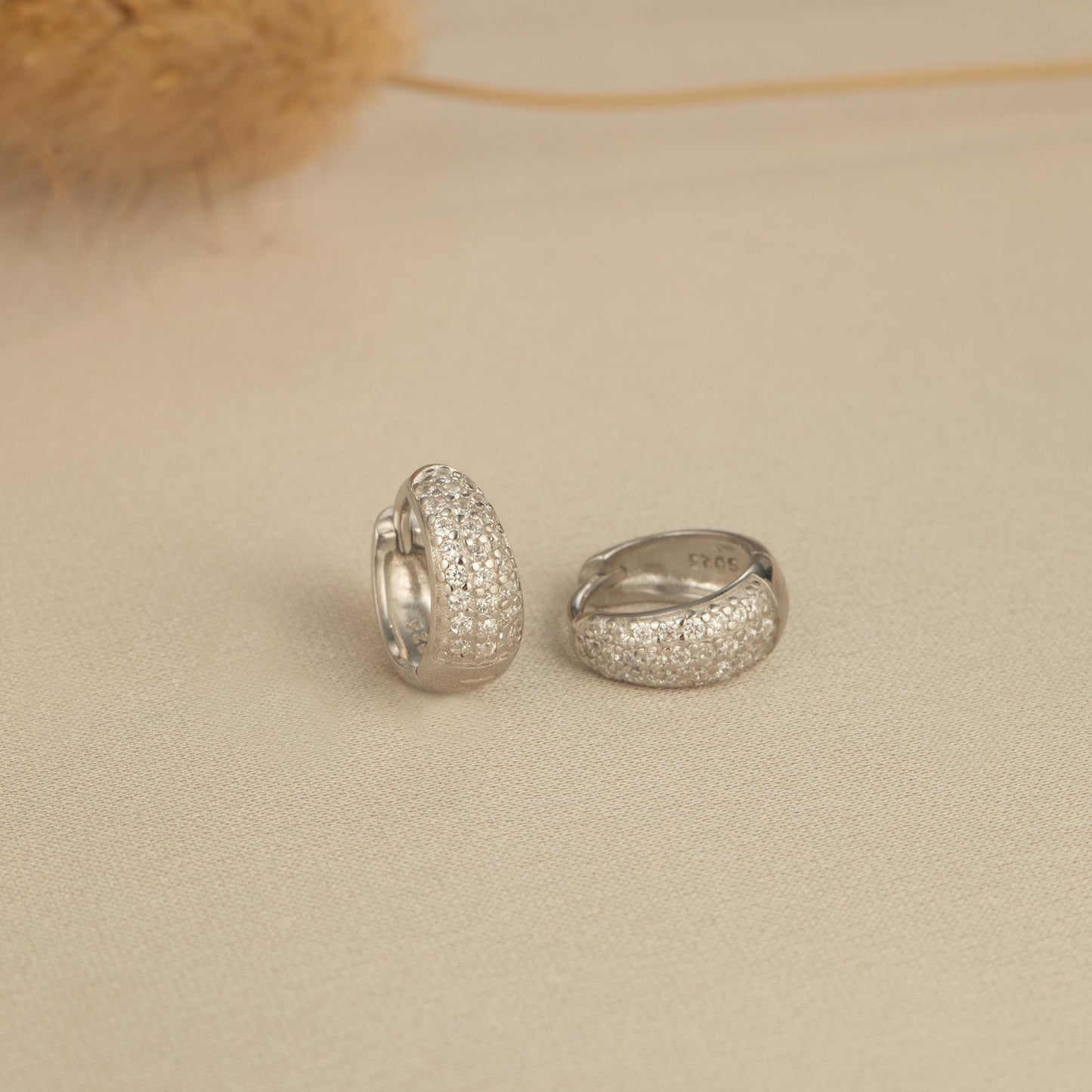 a couple of rings sitting on top of a bed