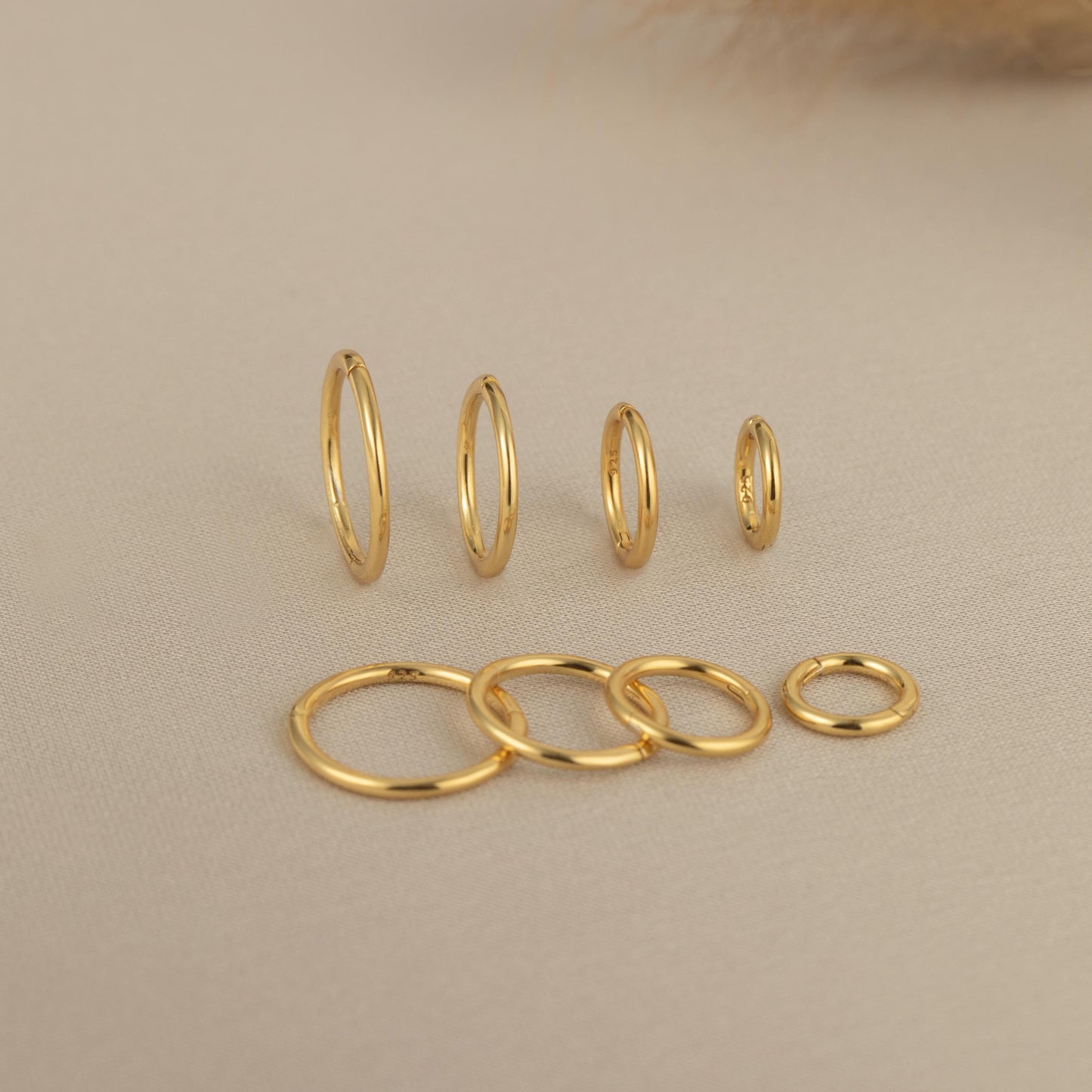 a group of gold rings sitting on top of a table