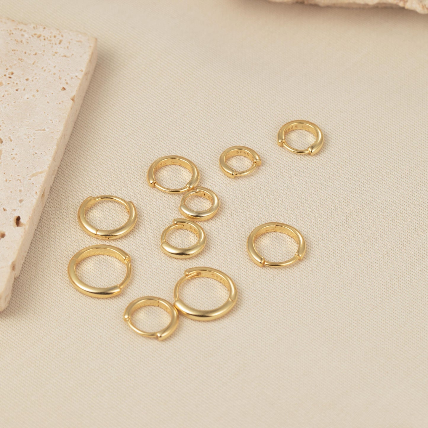 a group of gold rings sitting on top of a table