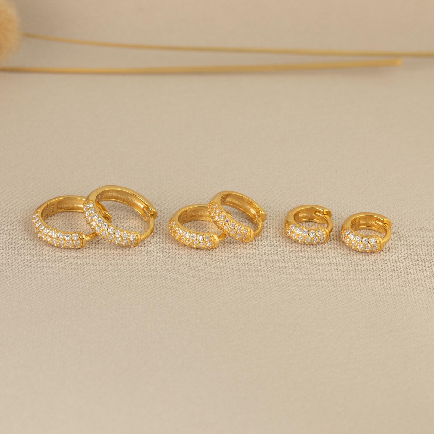 a set of three gold rings with diamonds
