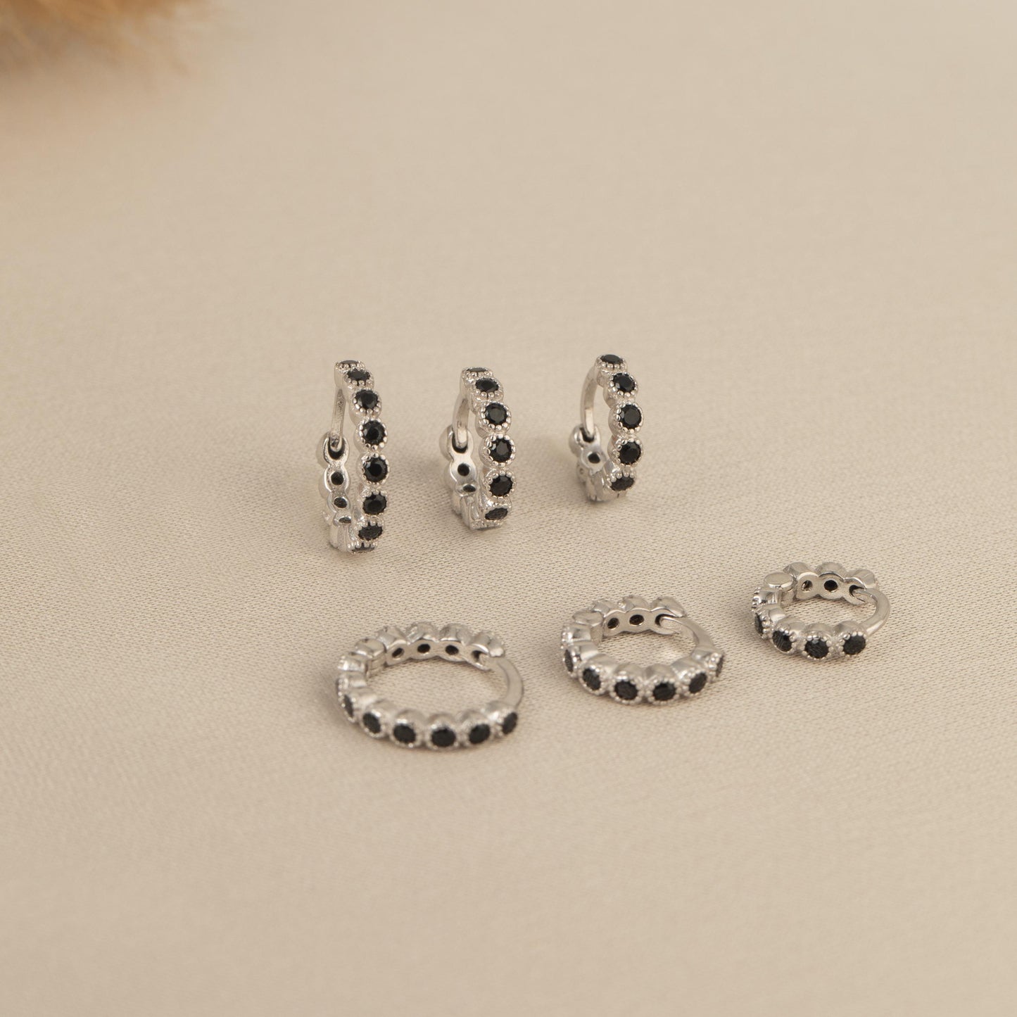 a set of five pairs of beaded rings