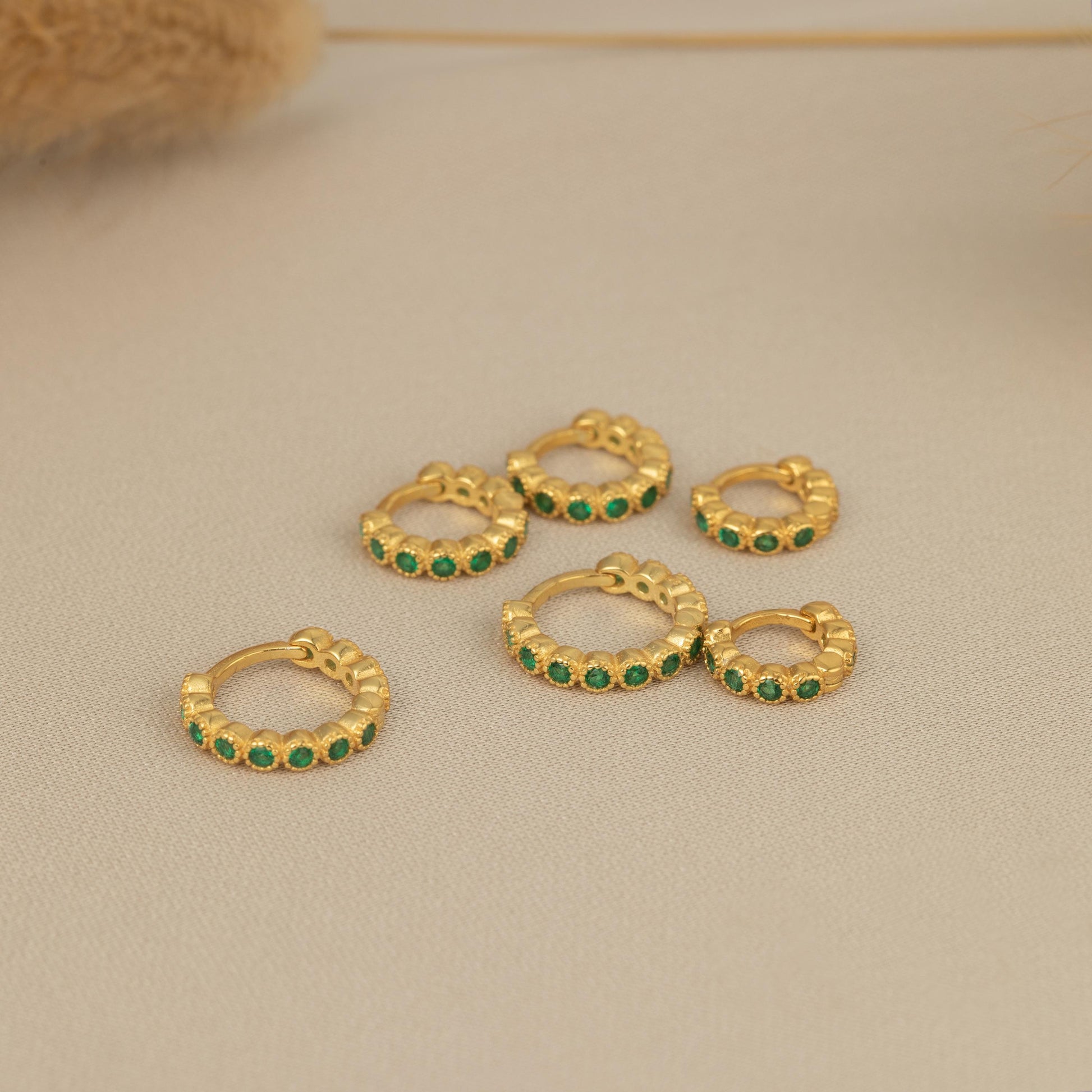 a bunch of small green stones sitting on top of a table
