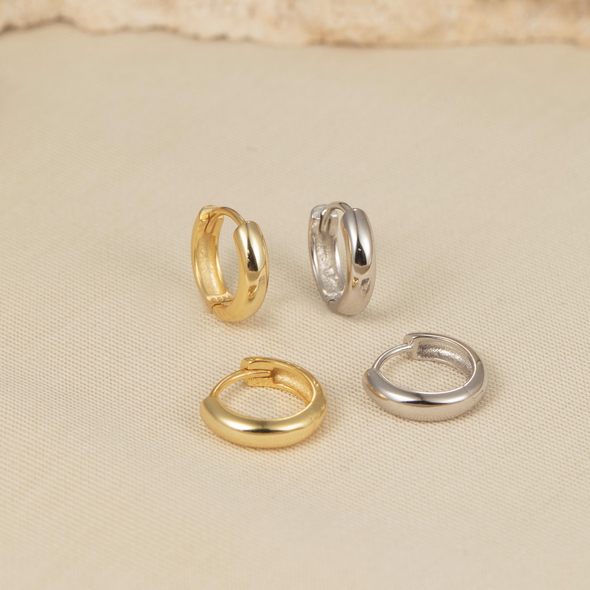 four different types of rings on a white surface