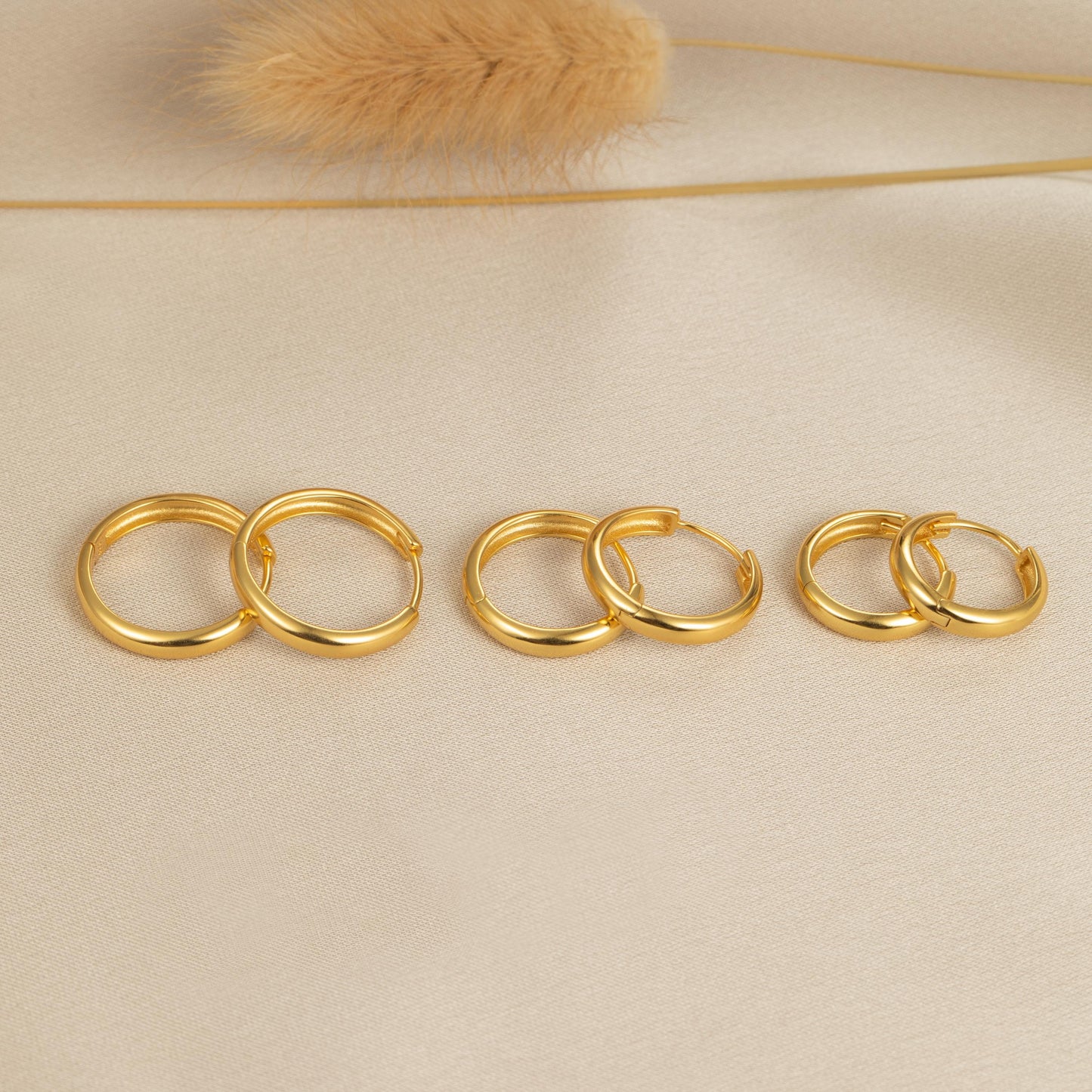a group of gold rings sitting on top of a table