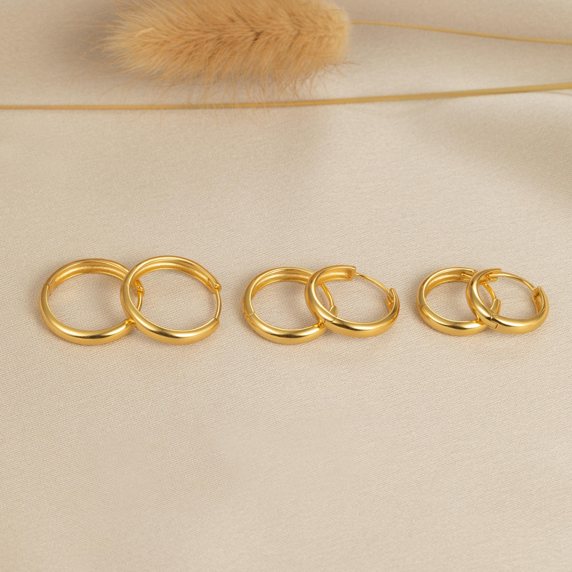 a group of gold rings sitting on top of a table