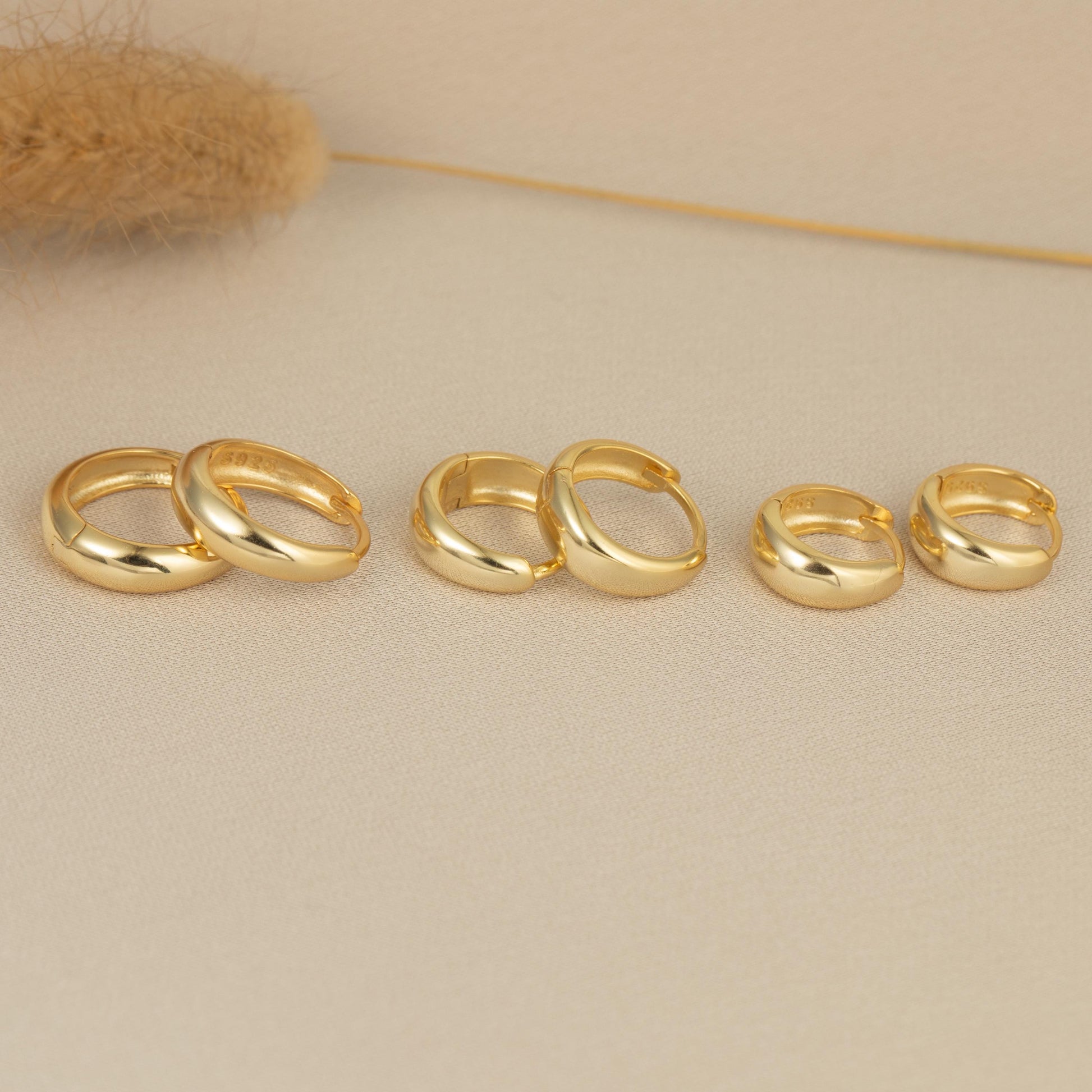 a group of gold rings sitting on top of a table