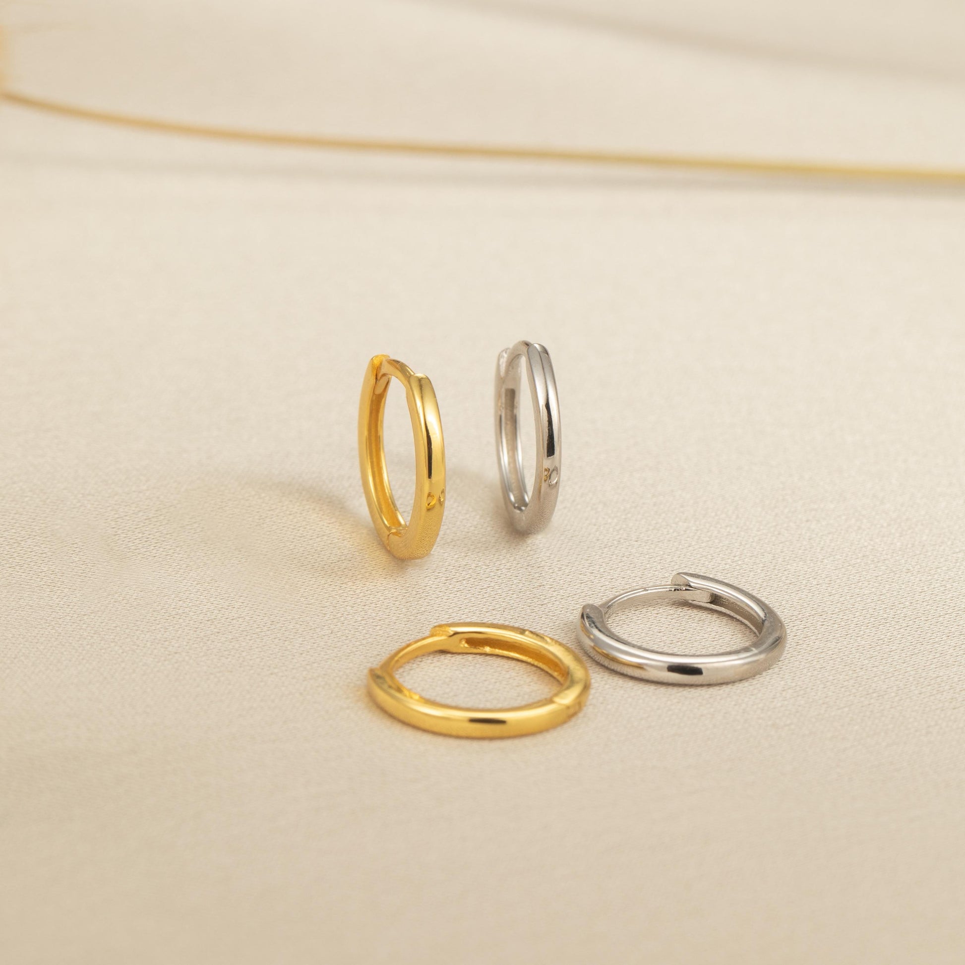 three different types of rings on a white surface