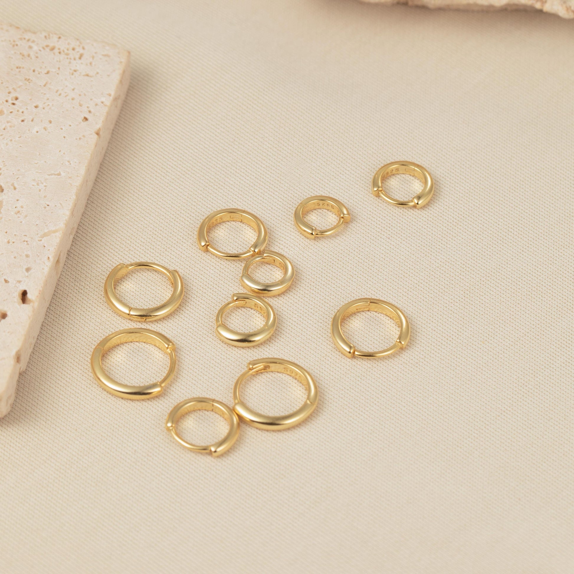 a group of gold rings sitting on top of a table