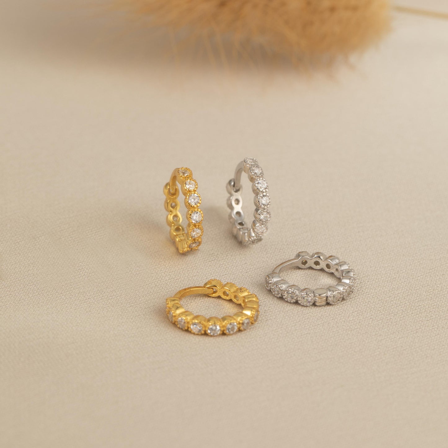 four different types of rings sitting on a table