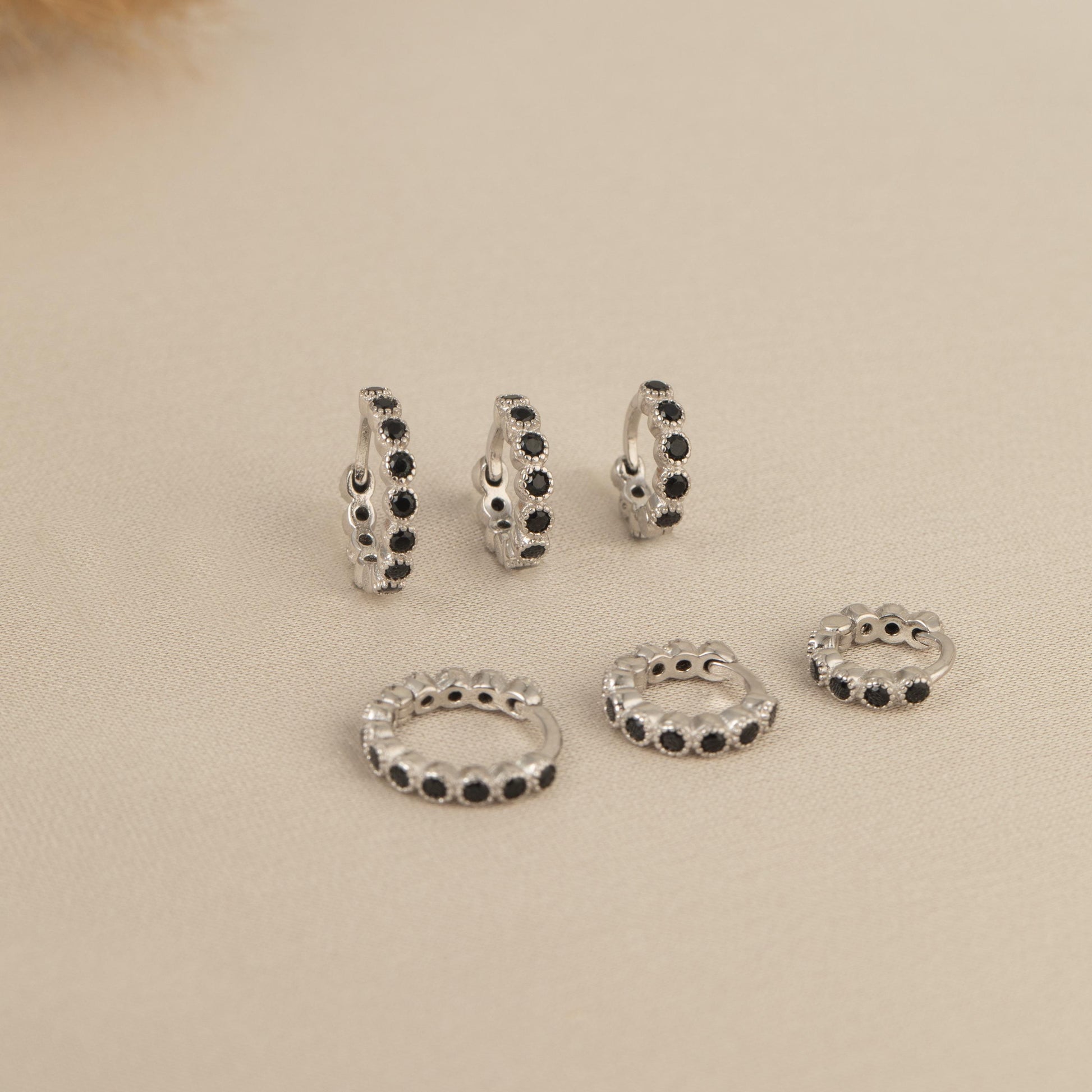 a set of five pairs of beaded rings