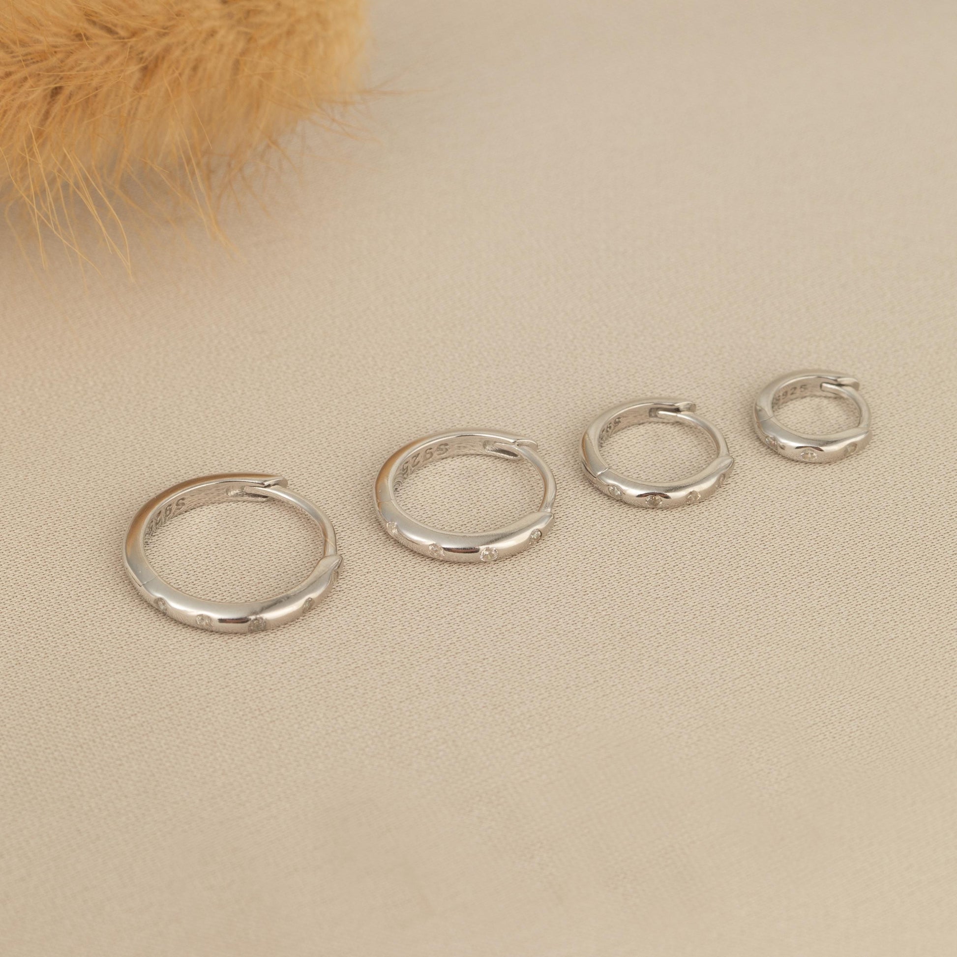 a group of five rings sitting on top of a table